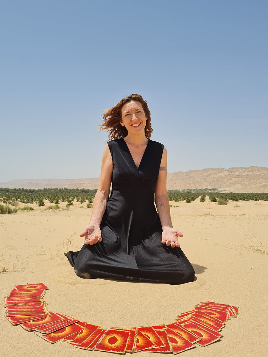 Sinéad Fine in the desert with a Tarot deck