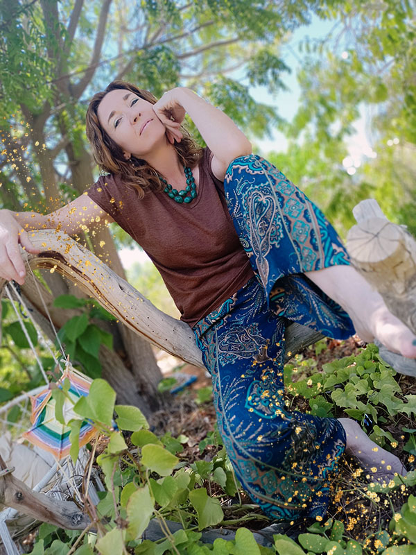 Sinéad Fine sitting on a branch in the garden